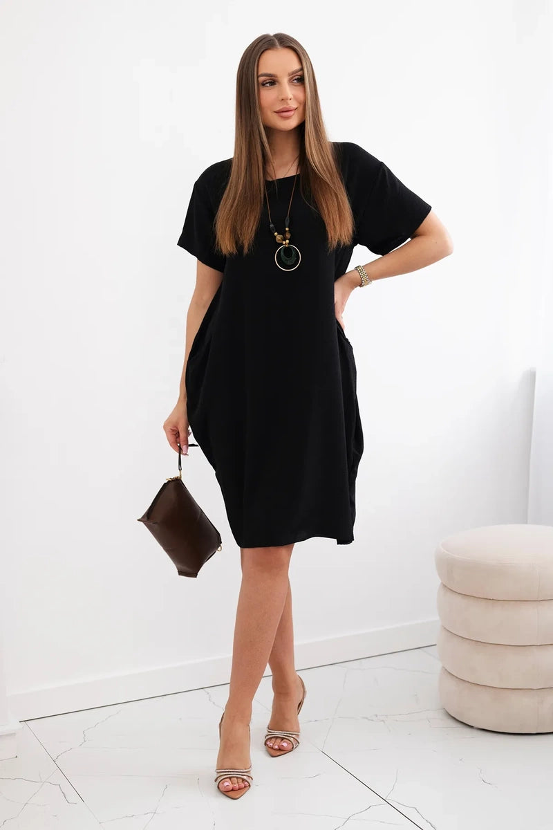 Dress with pockets and pendant