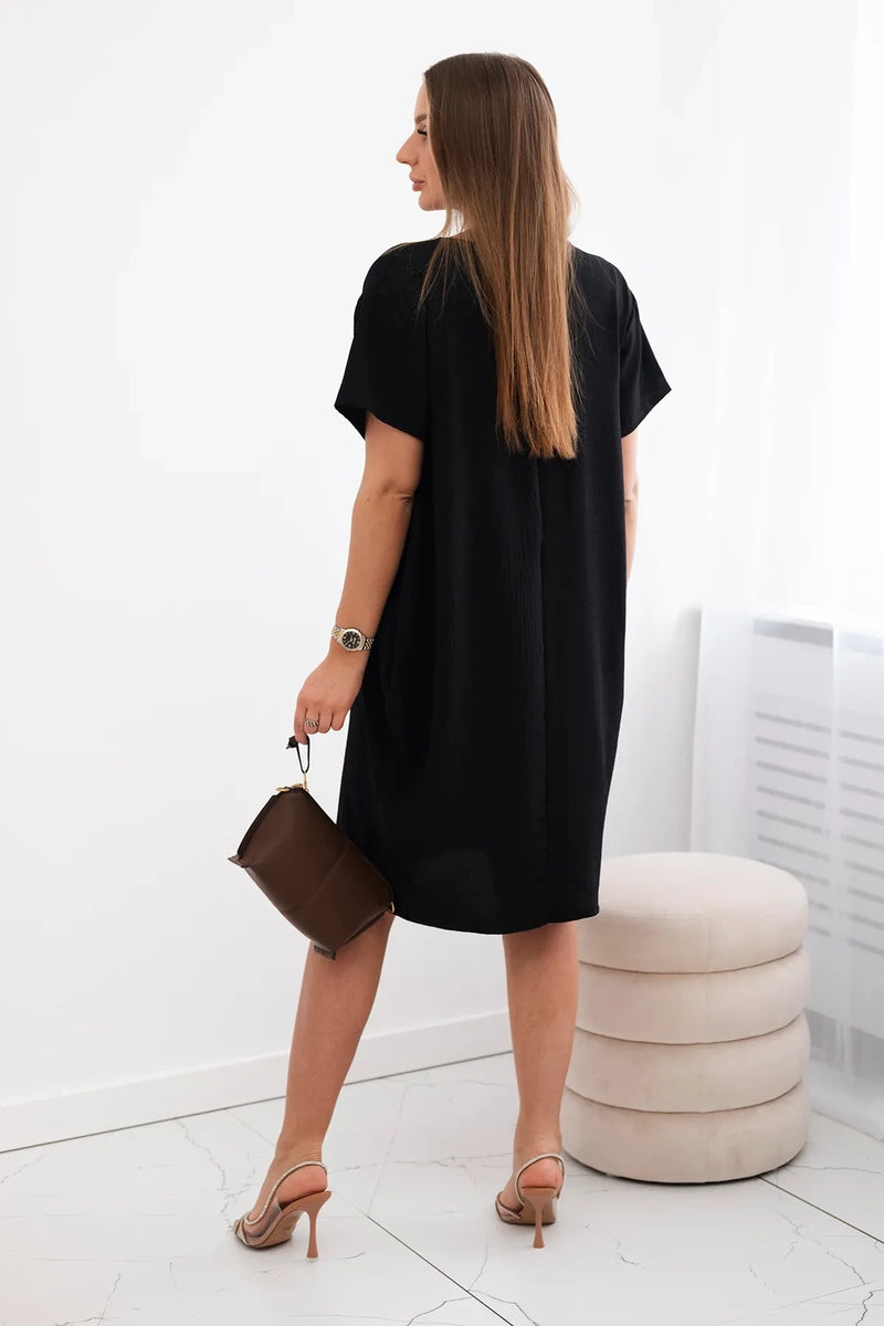 Dress with pockets and pendant