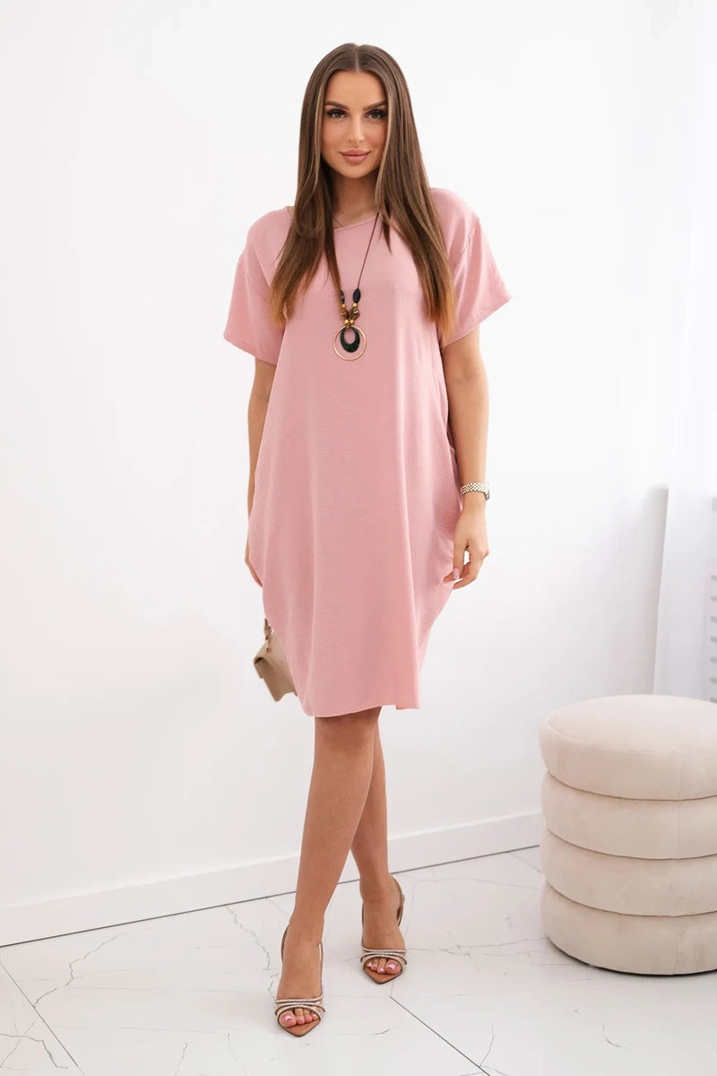 Dress with pockets and pendant