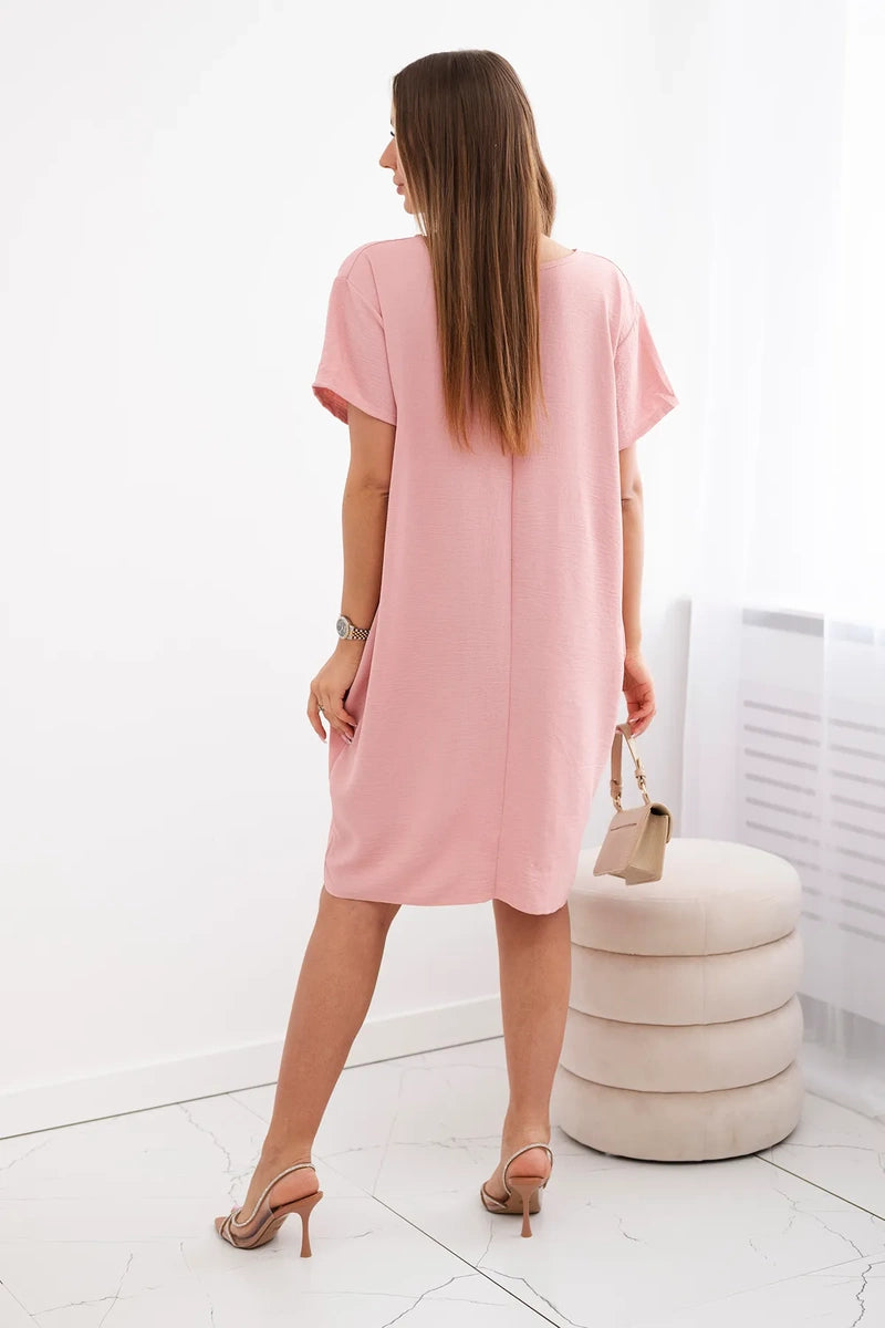 Dress with pockets and pendant
