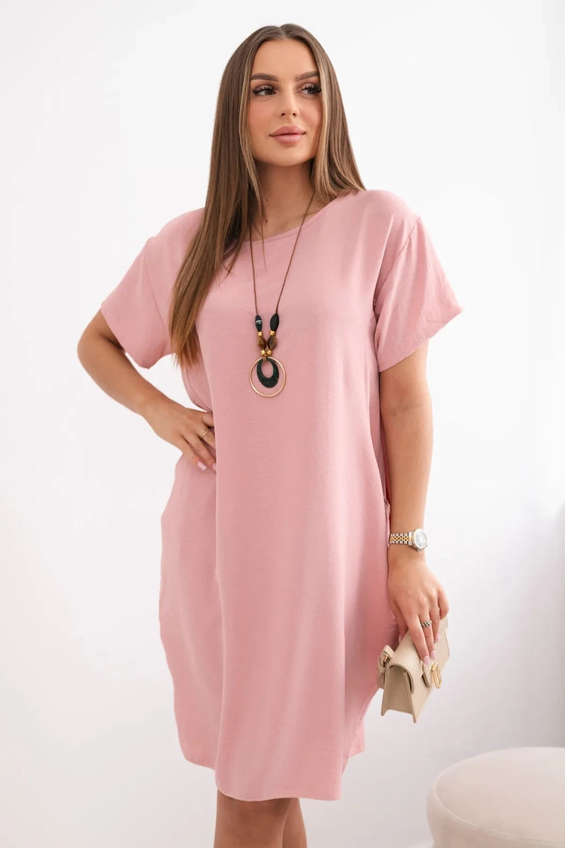 Dress with pockets and pendant