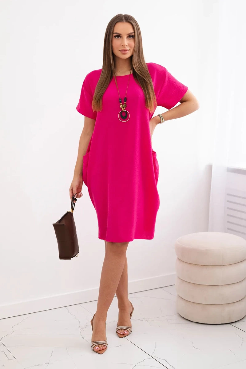 Dress with pockets and pendant