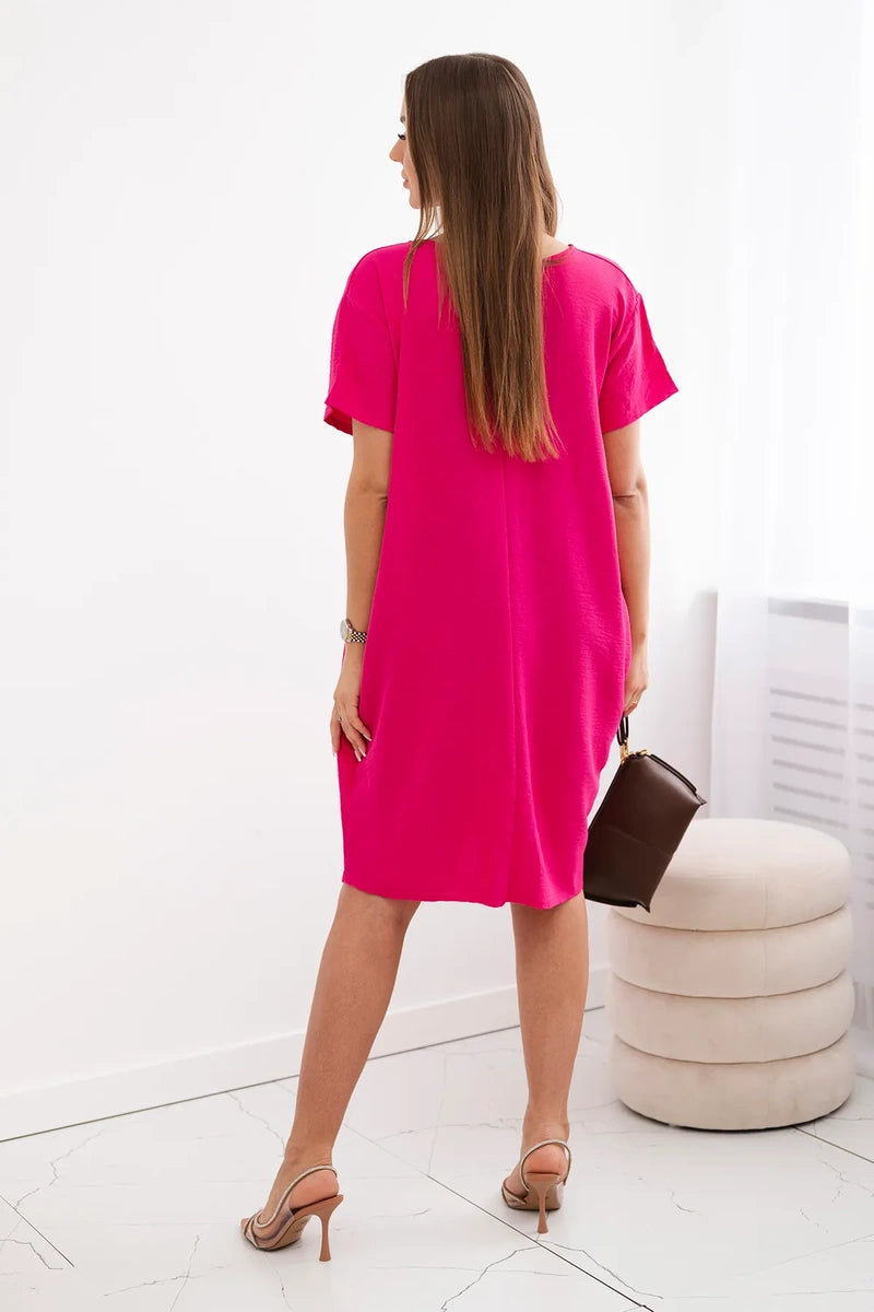 Dress with pockets and pendant